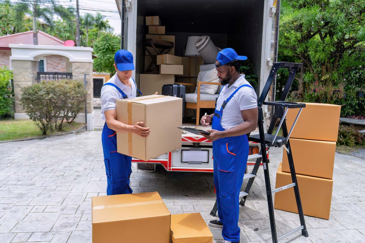Professional goods move service use truck carry personal belongings door to door transport delivery handover boxes luggage one by one and keep stack on the floor before transfer to place in house